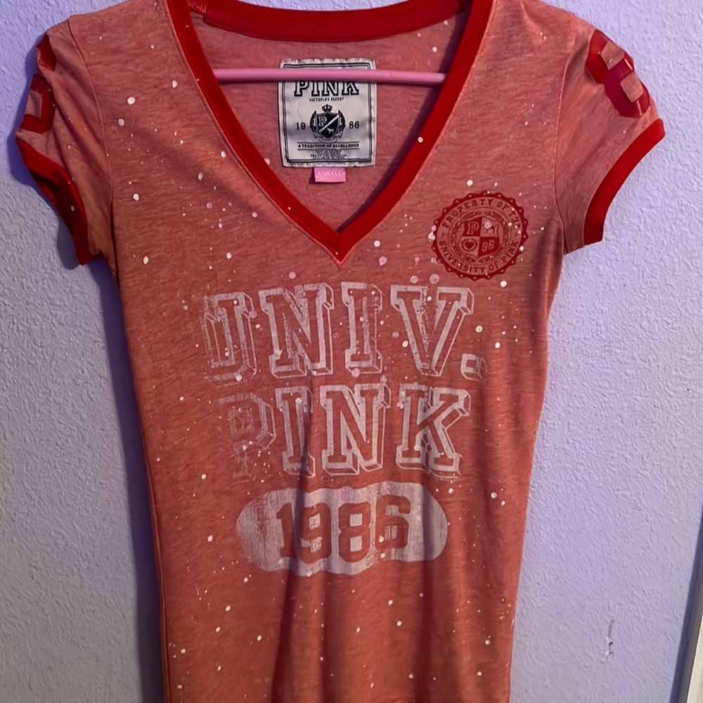 Pink Short sleeve tshirt "1986" says xs but fits more like a regular small.